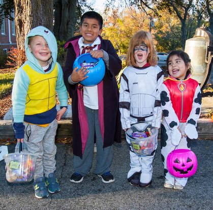 Children in costume at the 2016 Halloween party.
